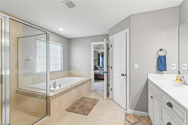 308 Queen Ct, Smithfield, VA 23430 - ensuite bathroom featuring a garden tub, vanity, a shower stall, and tile patterned flooring
