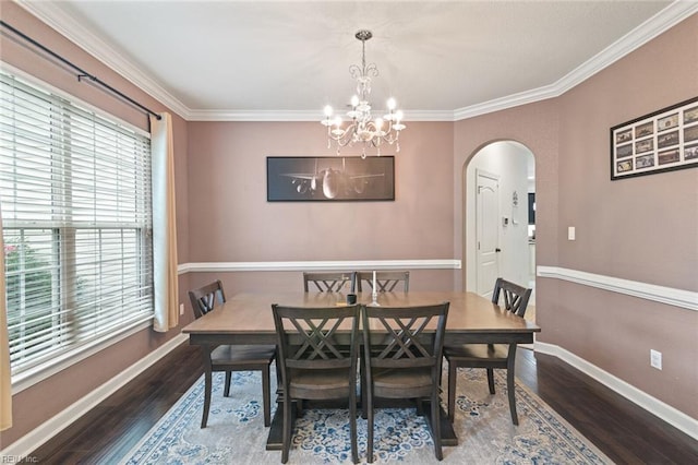 308 Queen Ct, Smithfield, VA 23430 - dining space with arched walkways, wood finished floors, crown molding, and a chandelier