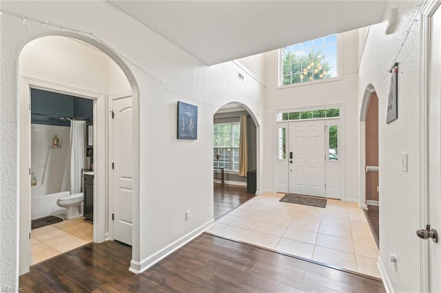 308 Queen Ct, Smithfield, VA 23430 - entryway featuring arched walkways, wood finished floors, and a textured wall