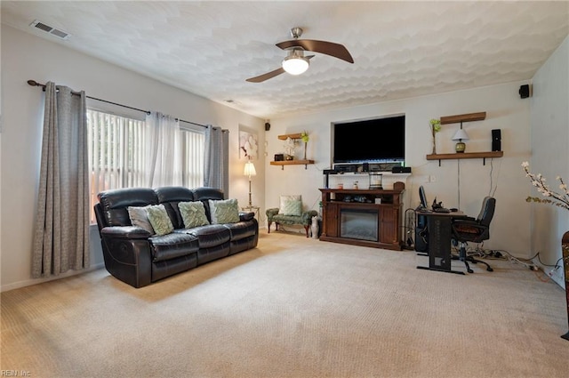 2559 Golden Maple Dr, Suffolk, VA 23434 - carpeted living area with ceiling fan and a glass covered fireplace