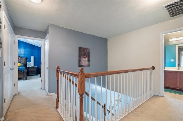 2559 Golden Maple Dr, Suffolk, VA 23434 - corridor with light carpet and an upstairs landing