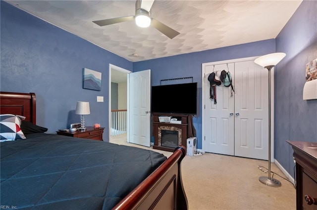 2559 Golden Maple Dr, Suffolk, VA 23434 - bedroom featuring light colored carpet, ceiling fan, and a closet