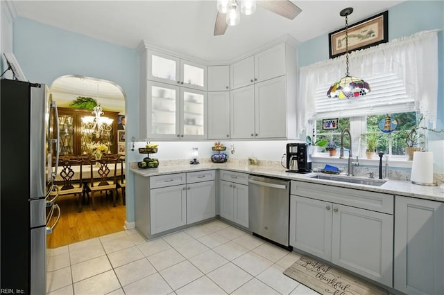 3644 Brannon Dr, Virginia Beach, VA 23456 - kitchen with appliances with stainless steel finishes, arched walkways, ceiling fan, pendant lighting, and light tile patterned floors