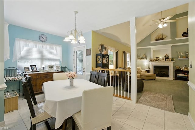 3644 Brannon Dr, Virginia Beach, VA 23456 - dining space with a large fireplace, light tile patterned floors, a ceiling fan, light colored carpet, and a chandelier