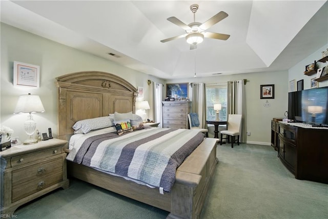 3644 Brannon Dr, Virginia Beach, VA 23456 - bedroom featuring a tray ceiling, light carpet, and a ceiling fan