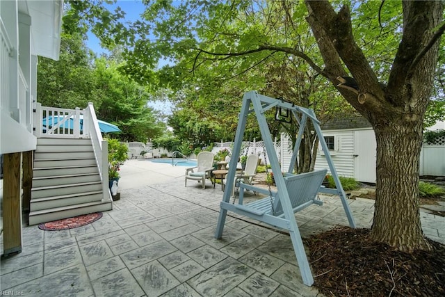 3644 Brannon Dr, Virginia Beach, VA 23456 - fenced backyard with stairway, a patio area, and a storage shed