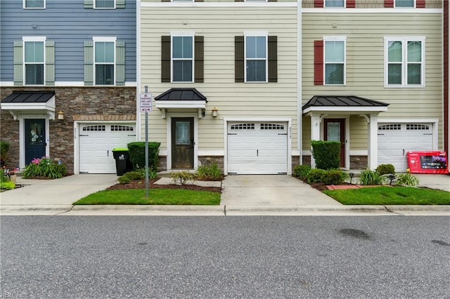 4317 Salt Marsh Ln, Chesapeake, VA 23324 - multi unit property featuring stone siding, a standing seam roof, driveway, and a garage