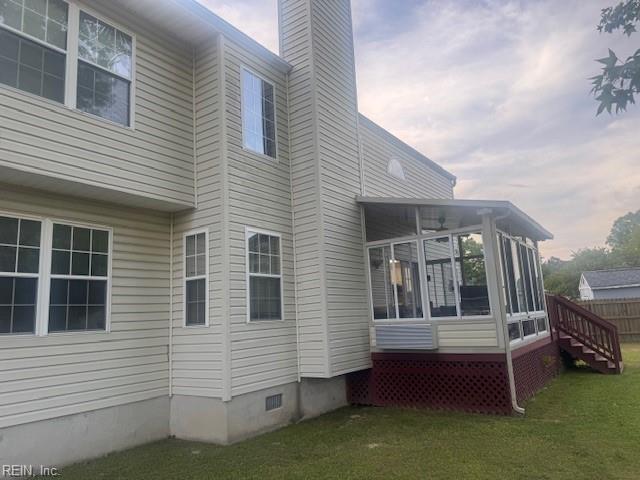 203 Lentz Pl, Newport News, VA 23602 - view of side of property with a sunroom, a chimney, a lawn, and crawl space