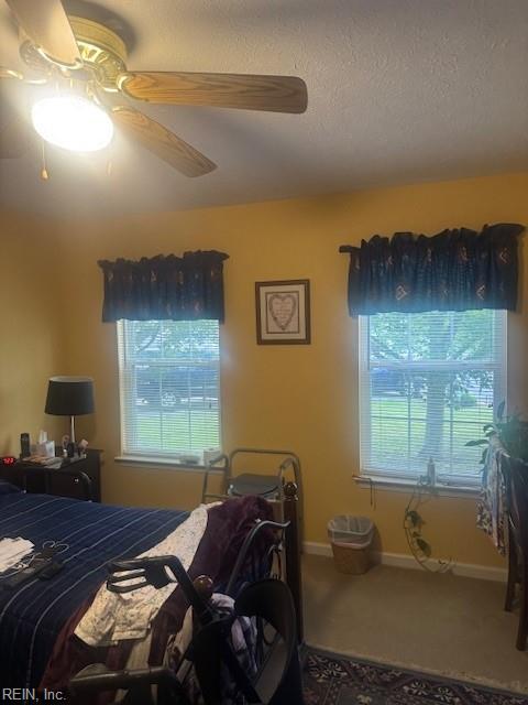 203 Lentz Pl, Newport News, VA 23602 - carpeted bedroom with multiple windows, ceiling fan, and a textured ceiling