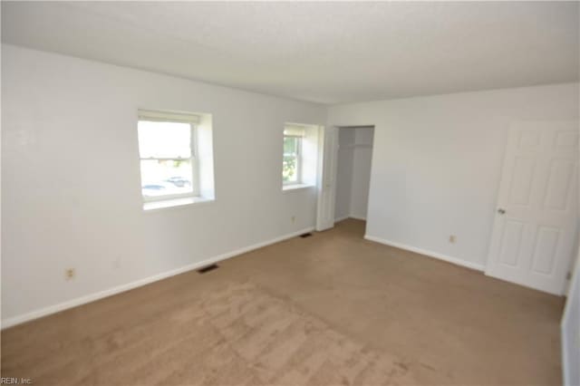 5668 Caxton Ct, Virginia Beach, VA 23462 - unfurnished bedroom with light colored carpet and a closet