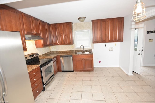 5668 Caxton Ct, Virginia Beach, VA 23462 - kitchen featuring appliances with stainless steel finishes, under cabinet range hood, tasteful backsplash, dark stone counters, and light tile patterned floors