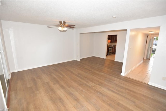 5668 Caxton Ct, Virginia Beach, VA 23462 - spare room featuring ceiling fan, wood finished floors, and a textured ceiling