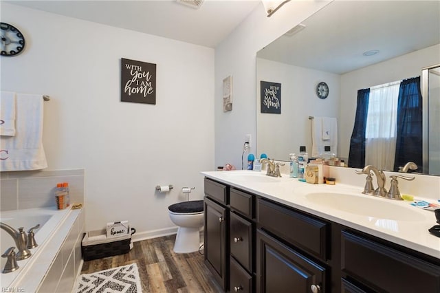 180 Avon Rd, Hampton, VA 23666 - bathroom featuring double vanity, a bath, and wood finished floors