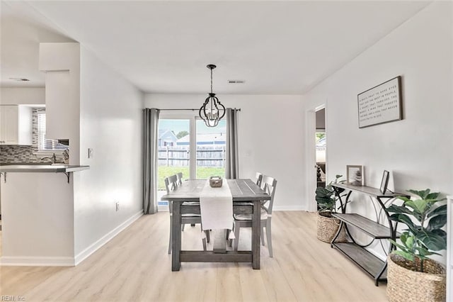 1256 Etworth Ln, Virginia Beach, VA 23464 - dining room with light wood finished floors, healthy amount of natural light, and a chandelier