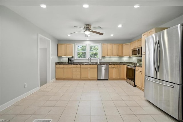 1505 Hawthorne Dr, Chesapeake, VA 23325 - kitchen with stainless steel appliances, light brown cabinets, dark countertops, ceiling fan, and recessed lighting
