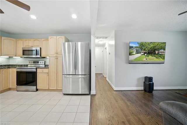 1505 Hawthorne Dr, Chesapeake, VA 23325 - kitchen featuring stainless steel appliances, a ceiling fan, light brown cabinetry, dark countertops, and recessed lighting