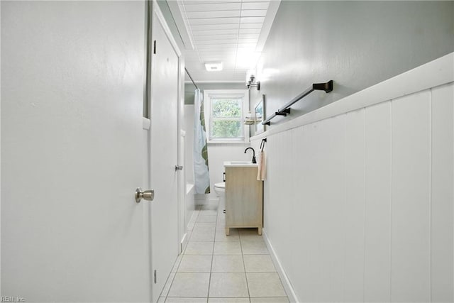 1505 Hawthorne Dr, Chesapeake, VA 23325 - hallway featuring light tile patterned floors and a sink