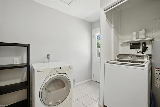 1505 Hawthorne Dr, Chesapeake, VA 23325 - laundry room with light tile patterned floors, water heater, and washer and dryer
