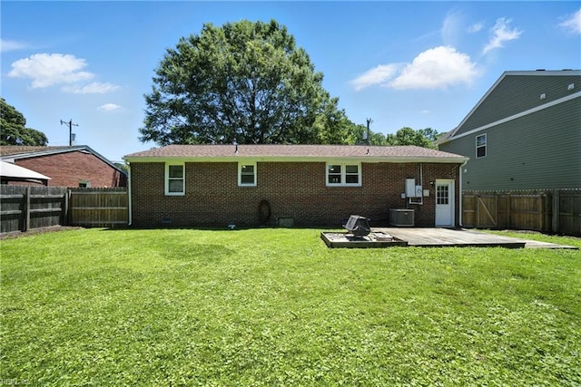 1505 Hawthorne Dr, Chesapeake, VA 23325 - back of property featuring a fenced backyard, a deck, brick siding, and crawl space