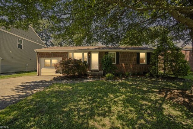 1505 Hawthorne Dr, Chesapeake, VA 23325 - ranch-style home with brick siding, a front lawn, and concrete driveway