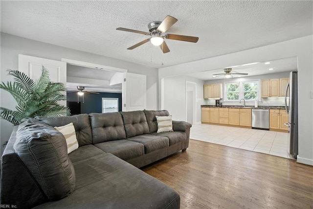 1505 Hawthorne Dr, Chesapeake, VA 23325 - living room featuring ceiling fan, light wood-style floors, and a textured ceiling