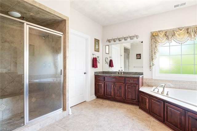 3033 N James Dr, Suffolk, VA 23435 - full bath with vanity, a bath, a stall shower, and tile patterned floors