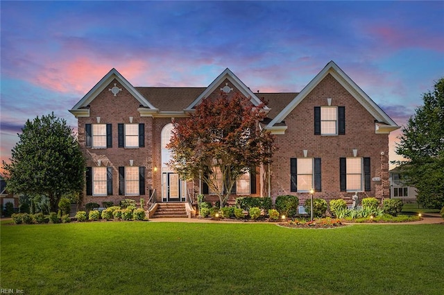 3033 N James Dr, Suffolk, VA 23435 - georgian-style home featuring a front lawn and brick siding
