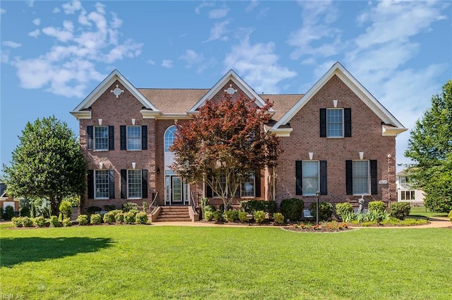 3033 N James Dr, Suffolk, VA 23435 - view of front of property featuring brick siding and a front yard