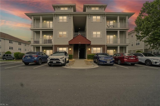 924 Southmoor Dr Unit 204, Virginia Beach, VA 23455 - property at dusk with uncovered parking