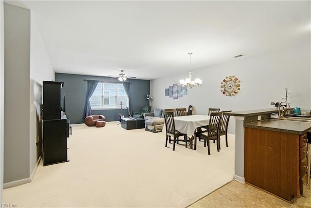 924 Southmoor Dr Unit 204, Virginia Beach, VA 23455 - dining space featuring light colored carpet, ceiling fan, and a chandelier