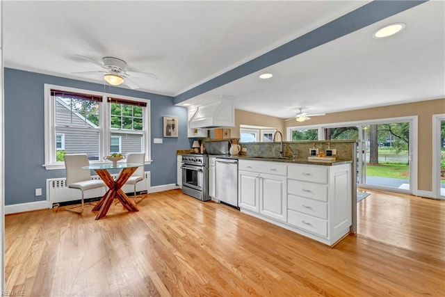 241 Sir Oliver Rd, Norfolk, VA 23505 - kitchen with stainless steel appliances, a ceiling fan, a peninsula, light wood finished floors, and recessed lighting