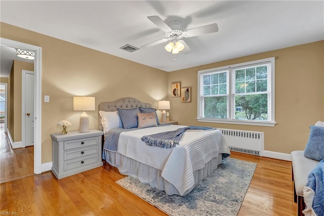 241 Sir Oliver Rd, Norfolk, VA 23505 - bedroom with radiator heating unit, light wood finished floors, and ceiling fan