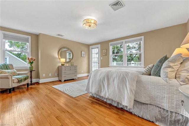 241 Sir Oliver Rd, Norfolk, VA 23505 - bedroom with multiple windows and wood finished floors