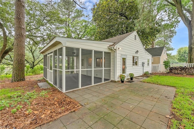 241 Sir Oliver Rd, Norfolk, VA 23505 - back of house featuring a sunroom and a patio area