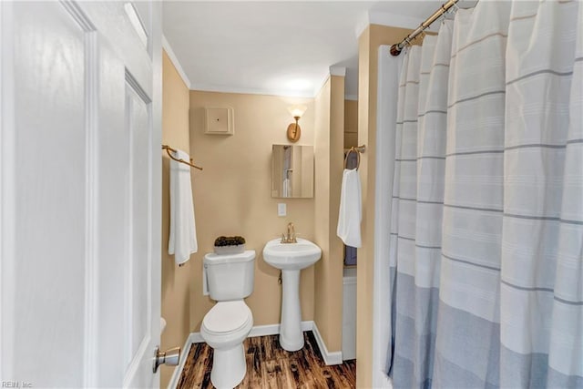 241 Sir Oliver Rd, Norfolk, VA 23505 - bathroom with wood finished floors, a shower with curtain, and ornamental molding
