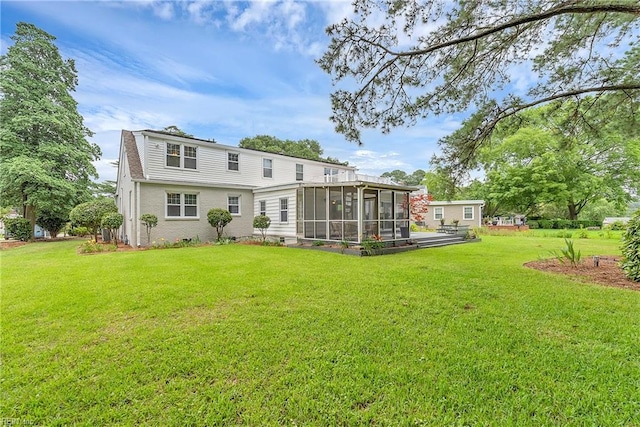 241 Sir Oliver Rd, Norfolk, VA 23505 - back of property with a sunroom and a lawn