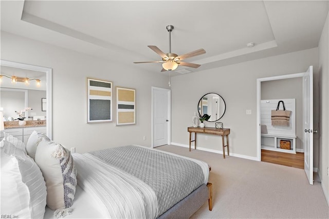 1015 Hillpoint Rd, Suffolk, VA 23434 - carpeted bedroom with a raised ceiling, ensuite bath, and ceiling fan