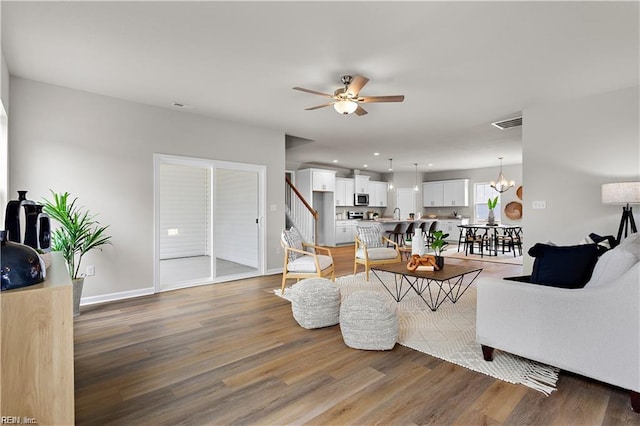 1015 Hillpoint Rd, Suffolk, VA 23434 - living area with a ceiling fan, wood finished floors, stairway, and recessed lighting