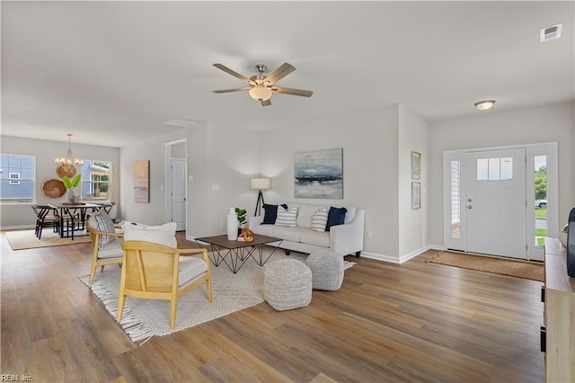 1015 Hillpoint Rd, Suffolk, VA 23434 - living area featuring a chandelier, wood finished floors, and ceiling fan