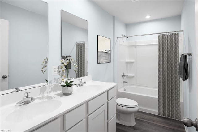 3617 Clyde St, Elizabeth City, NC 27909 - full bathroom featuring wood finished floors, double vanity, and shower / bath combination with curtain