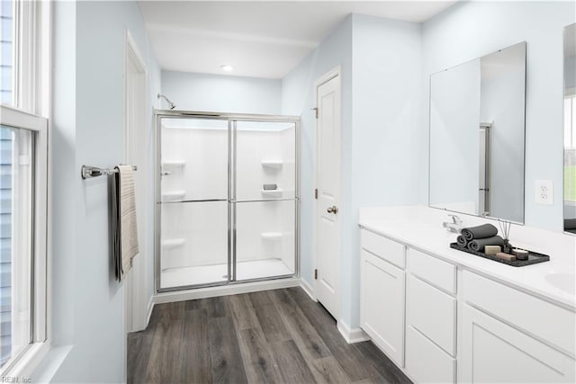 3617 Clyde St, Elizabeth City, NC 27909 - full bathroom featuring wood finished floors, double vanity, and a stall shower