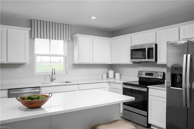 3617 Clyde St, Elizabeth City, NC 27909 - kitchen with appliances with stainless steel finishes, white cabinetry, light countertops, and recessed lighting