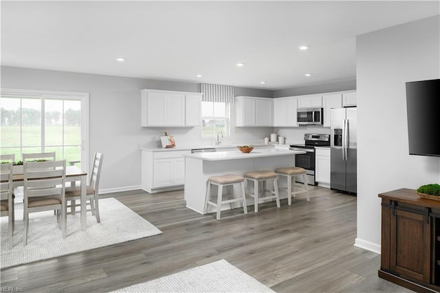 3617 Clyde St, Elizabeth City, NC 27909 - kitchen featuring stainless steel appliances, plenty of natural light, a kitchen island, light countertops, and recessed lighting