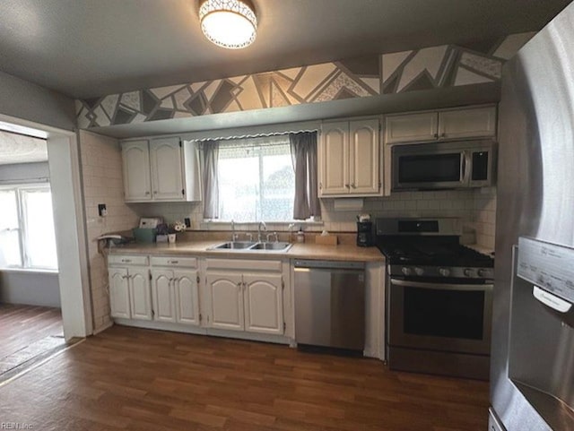 565 River Creek Rd, Chesapeake, VA 23320 - kitchen with stainless steel appliances, tasteful backsplash, dark wood-style floors, white cabinetry, and light countertops