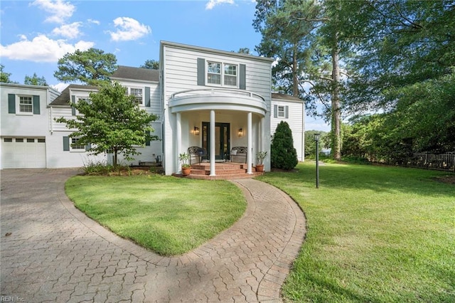 6070 Newport Pt, Norfolk, VA 23505 - view of front of house with driveway, a front lawn, and an attached garage