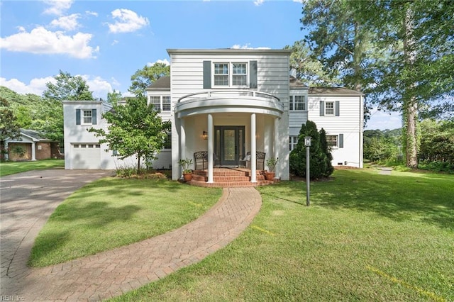 6070 Newport Pt, Norfolk, VA 23505 - view of front of house with concrete driveway, a garage, and a front lawn