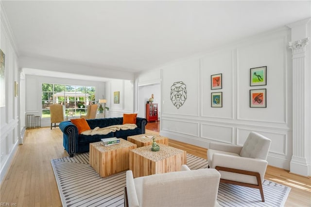 6070 Newport Pt, Norfolk, VA 23505 - living area with a decorative wall, light wood-style floors, radiator, and ornamental molding