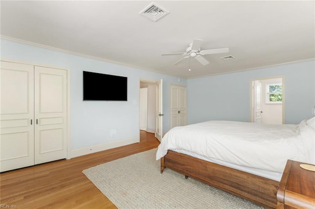 6070 Newport Pt, Norfolk, VA 23505 - bedroom with crown molding, light wood finished floors, a ceiling fan, and connected bathroom