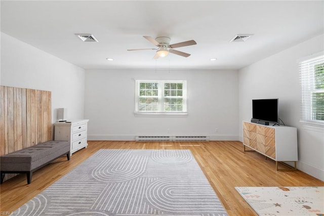 6070 Newport Pt, Norfolk, VA 23505 - unfurnished room featuring baseboard heating, a ceiling fan, and light wood-style flooring