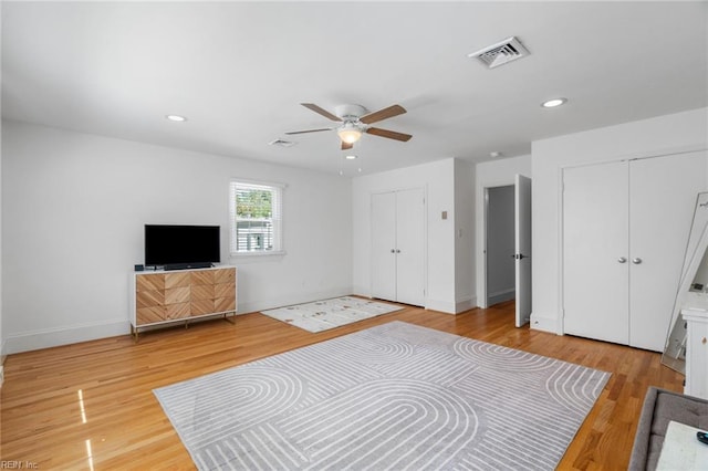 6070 Newport Pt, Norfolk, VA 23505 - unfurnished bedroom with multiple closets, light wood-type flooring, a ceiling fan, and recessed lighting